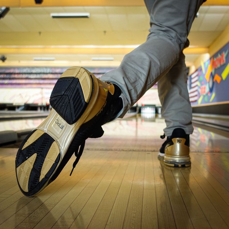 KR Strikeforce Unisex TPC Alpha Black/Gold Right Hand Bowling Shoes Action Shot